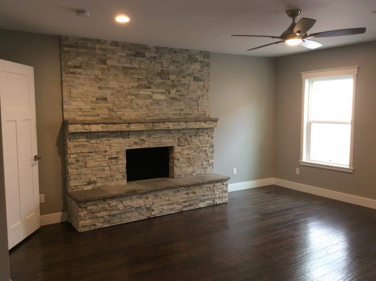 Residential painted room with fan and fireplace included