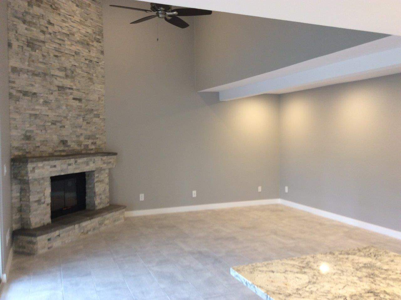 Residential house with fireplace and new paint job