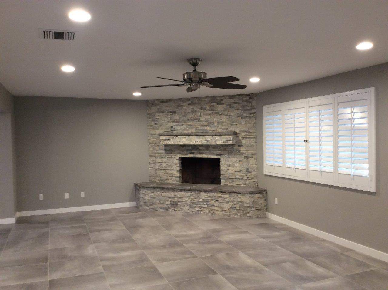 Newly painted room with fireplace